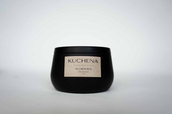 Black KUCHENA Sugar Scrub container against a white background