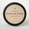 Photo of a round black can with body butter fragrance free written on it