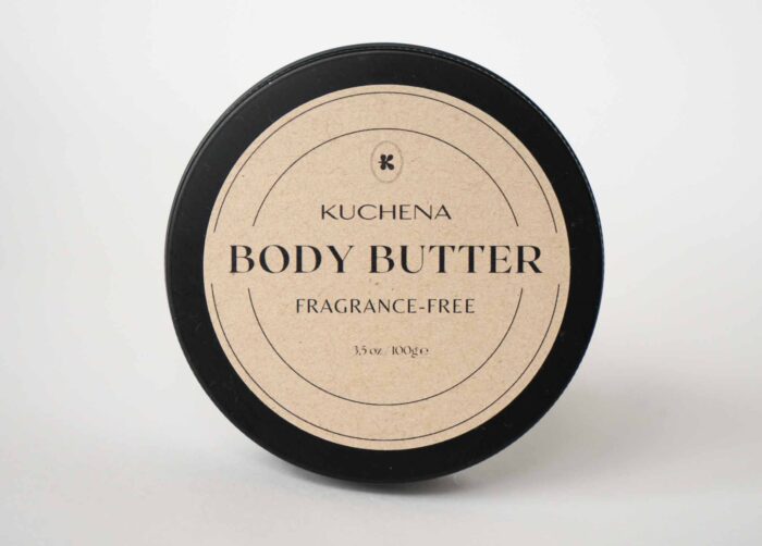Body Butter Fragrance Free Kuchena Photo of a round black can with body butter fragrance free written on it